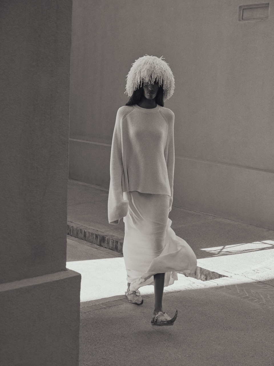 Bibi wears an Altuzarra beaded fringe hat (special order), Altuzarra Lottie sweater ($795), Altuzarra silk slip skirt (special order) and locally sourced traditional Moroccan Khussa slippers. Bibi Abdulkadir by Su Mustecaplioglu 9